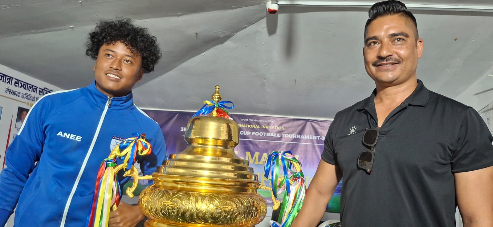 प्रथम कपसहित चर्च व्वाईज युनाइटेड ललितपुर मेनेजर सविन डाँगी र कप्तान विश्वास चौधरी ।